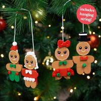 Set of gingerbread-themed Christmas ornaments on a tree with festive lights.
