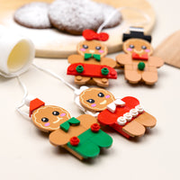 Gingerbread-themed keychains on a light background