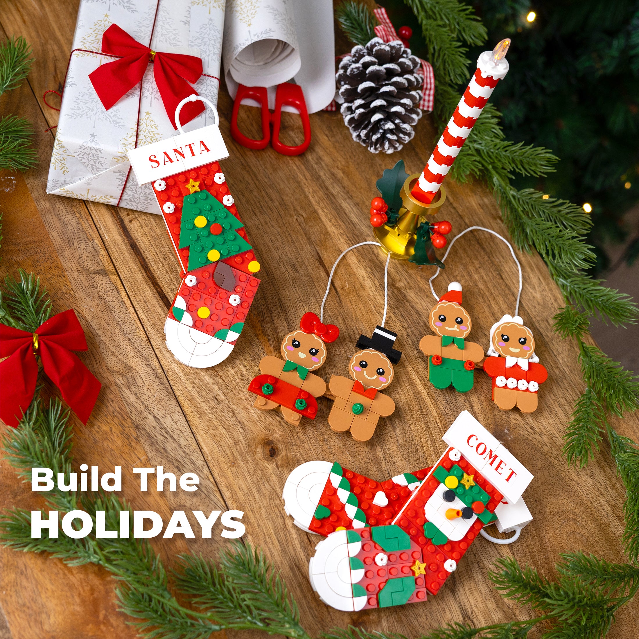 Christmas-themed decorations including gingerbread men, a stocking, and a candy cane on a wooden surface with greenery.