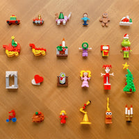 Collection of colorful toy figures on a wooden surface