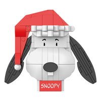 Toy figure of a dog with a red hat and 'SNOOPY' label on a white background