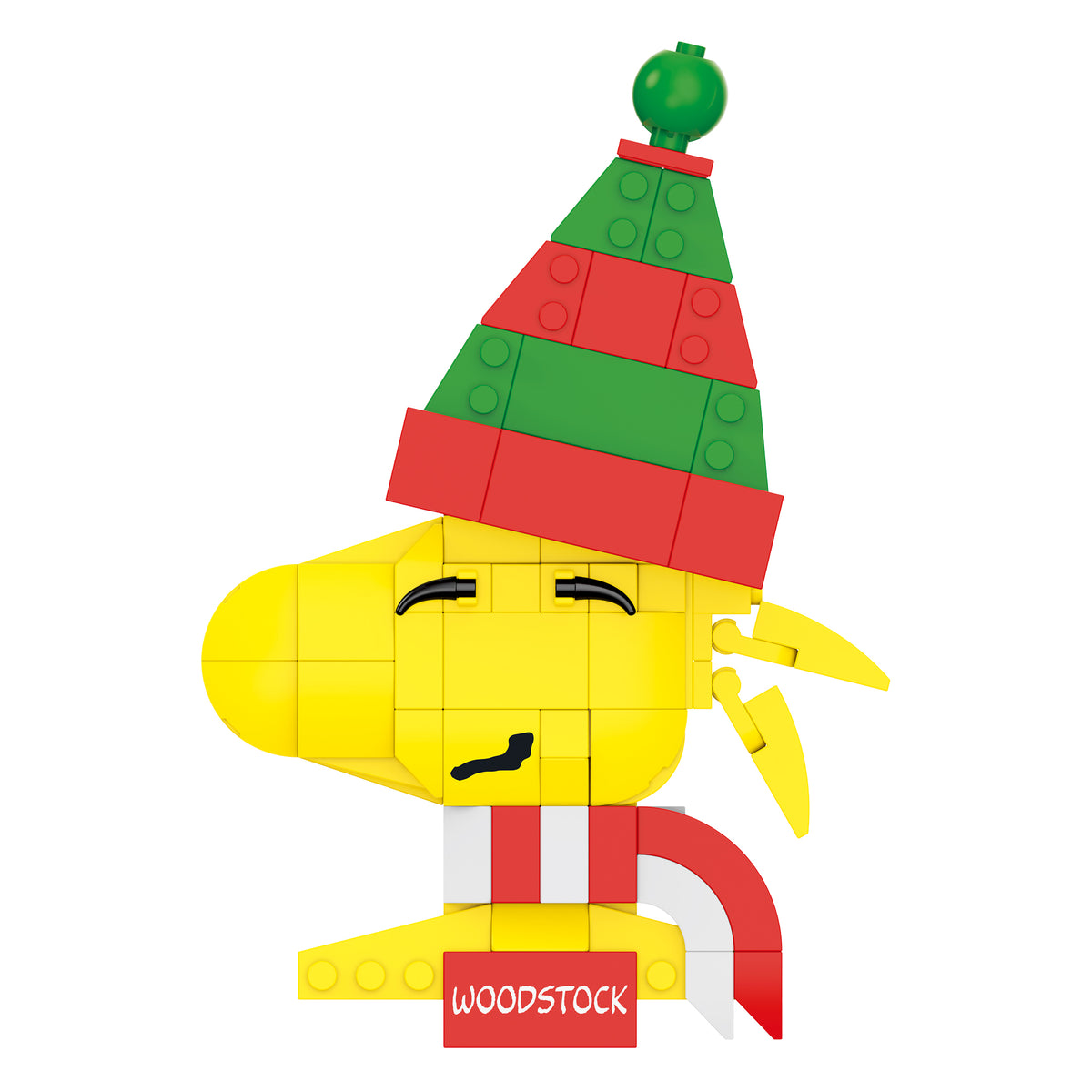 Toy figure of Woodstock from Peanuts with a green and red hat on a white background