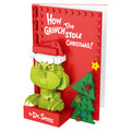 Brick book cover of 'How the Grinch Stole Christmas!' by Dr. Seuss with Grinch figure and Christmas tree.