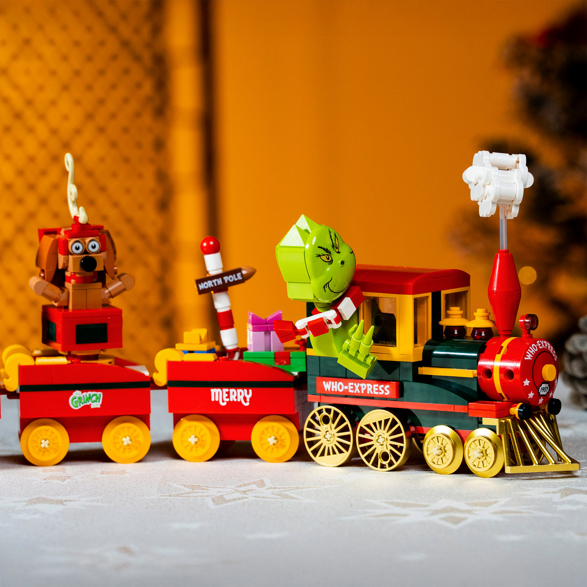 Toy train set with characters and Christmas-themed decorations.