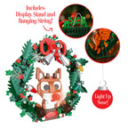 Christmas wreath building block set with fox figure, lights, and display stand on a white background