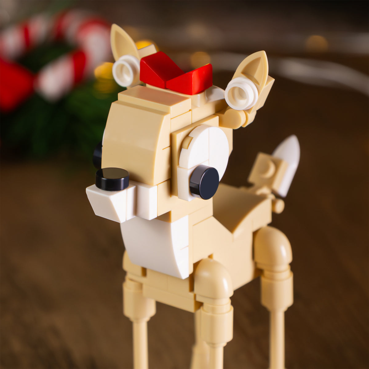 Toy reindeer made of interlocking bricks on a blurred background