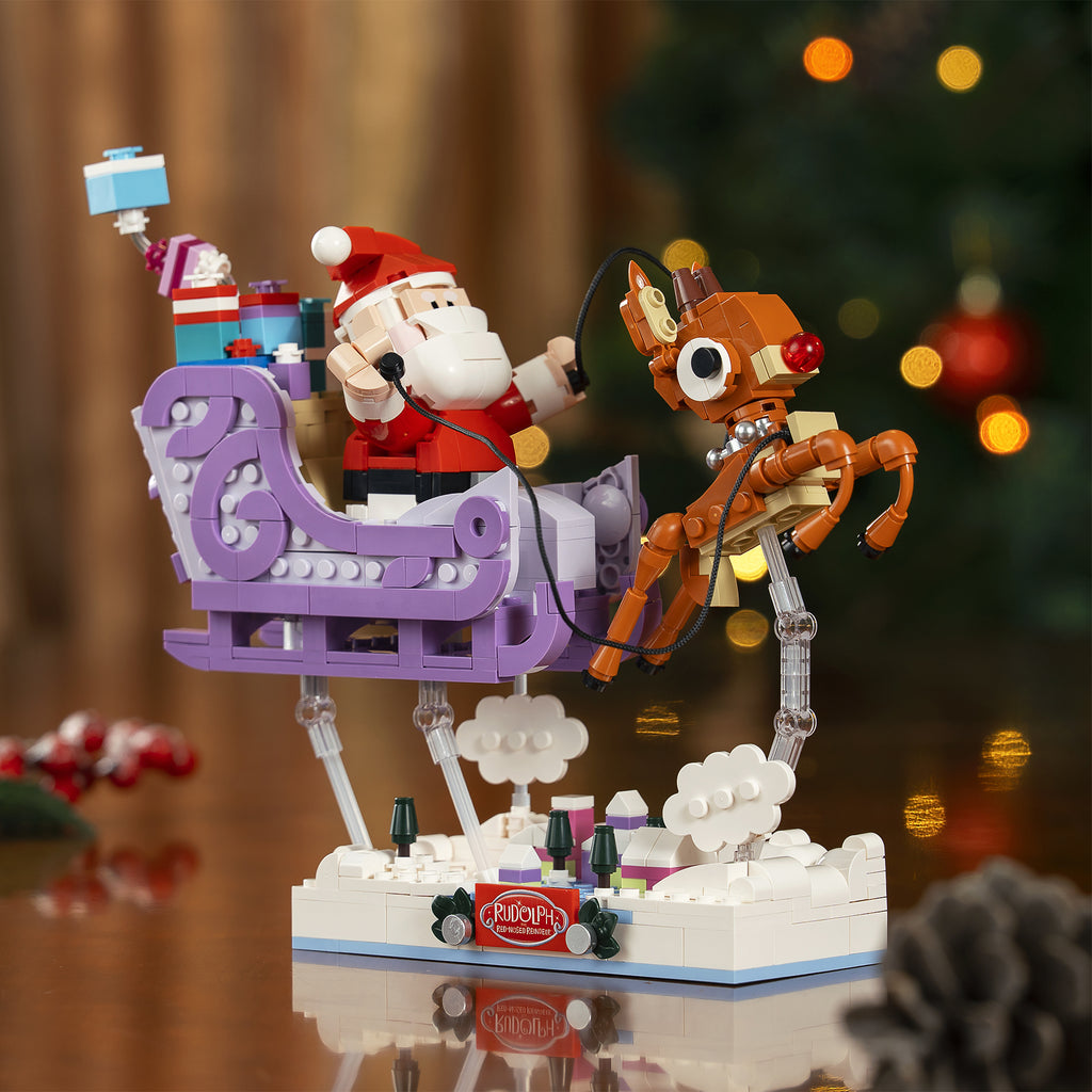 Brick Santa Claus in sleigh with reindeer against a festive background