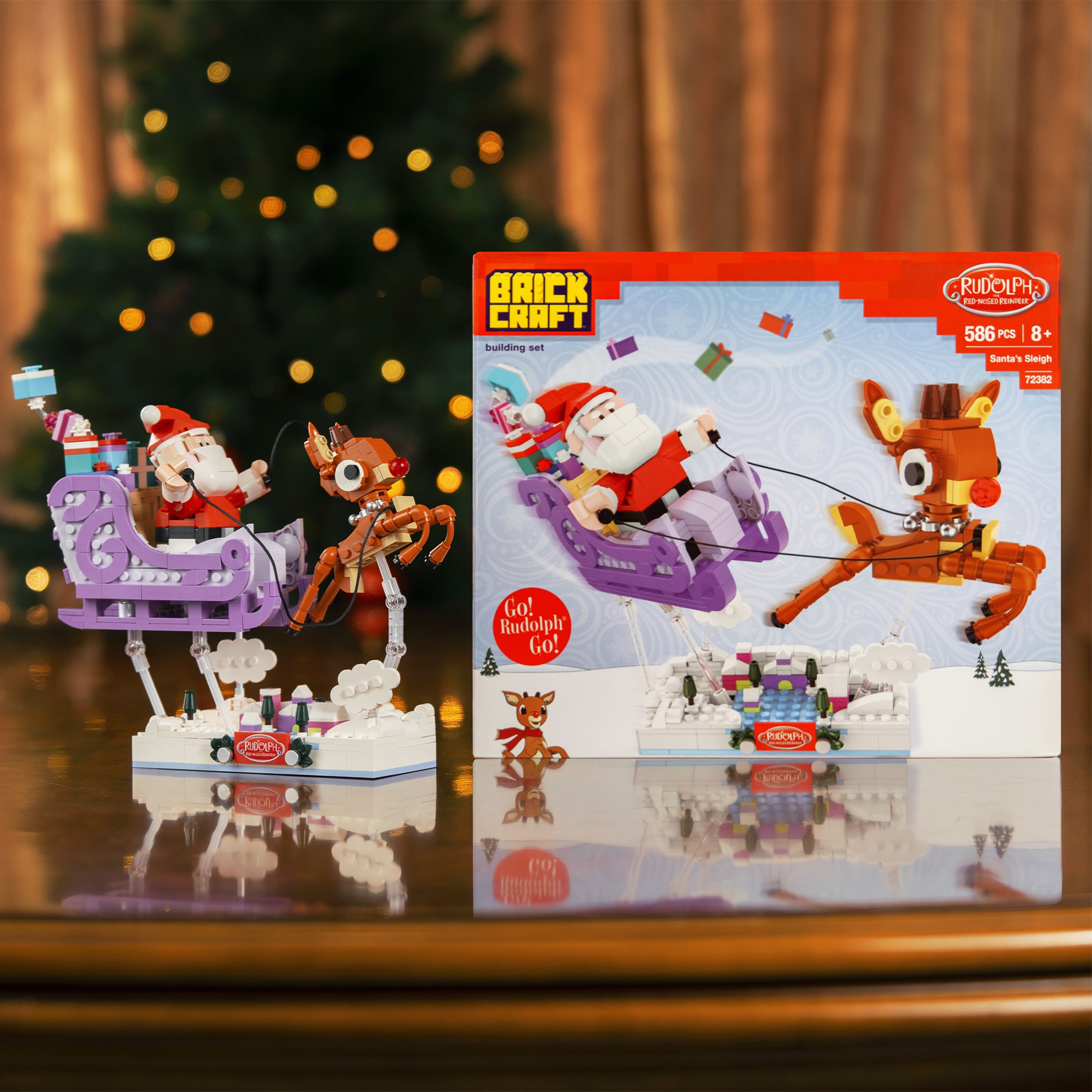 Brick Craft Santa Claus and reindeer toy set with packaging on a reflective surface.