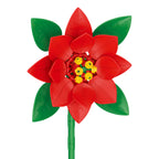 Red flower-shaped toy with green leaves on a white background