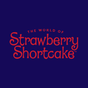 Logo of 'The World of Strawberry Shortcake' in red text on a dark blue background