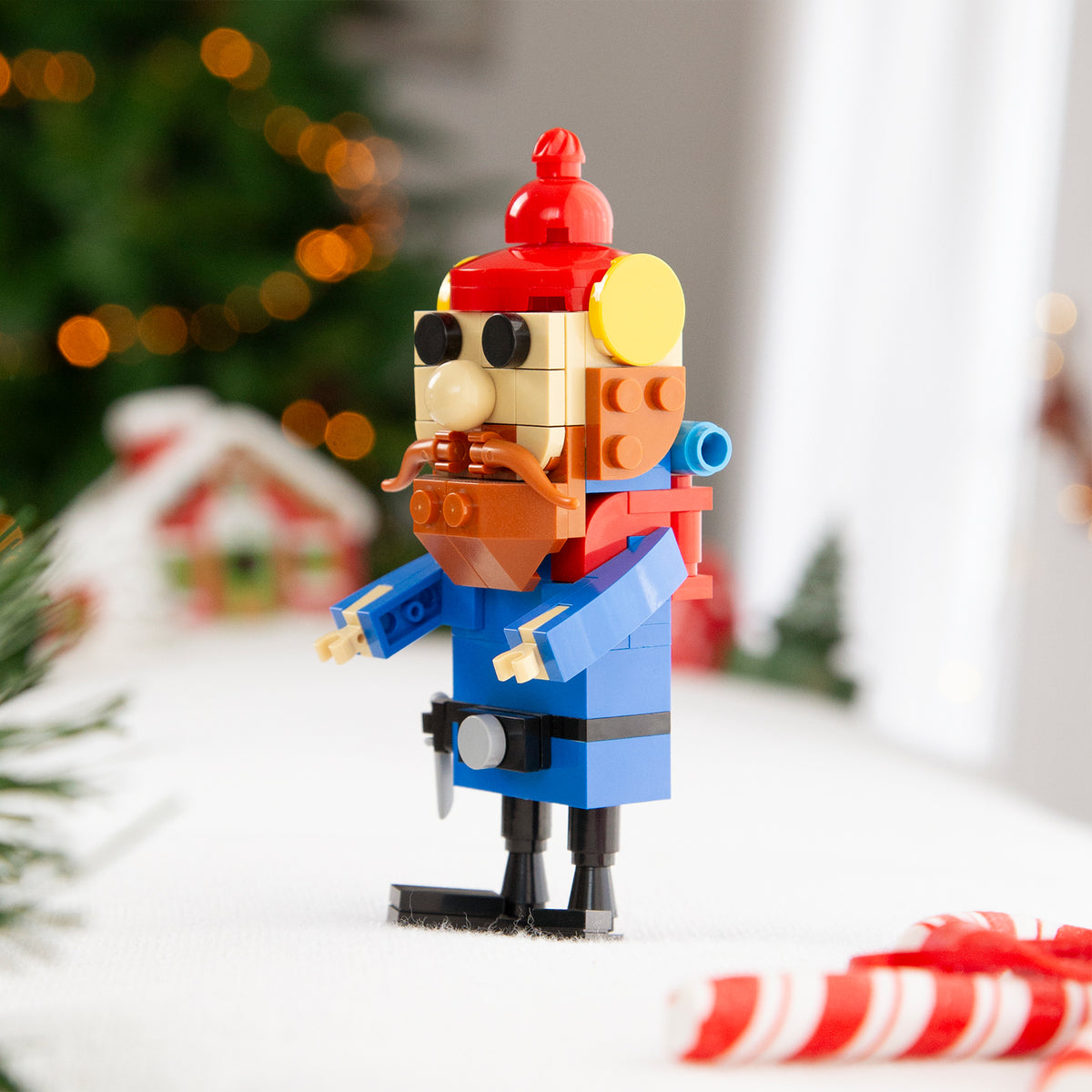 Toy figure of a nutcracker with festive background