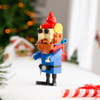 Toy figure of a nutcracker with festive background